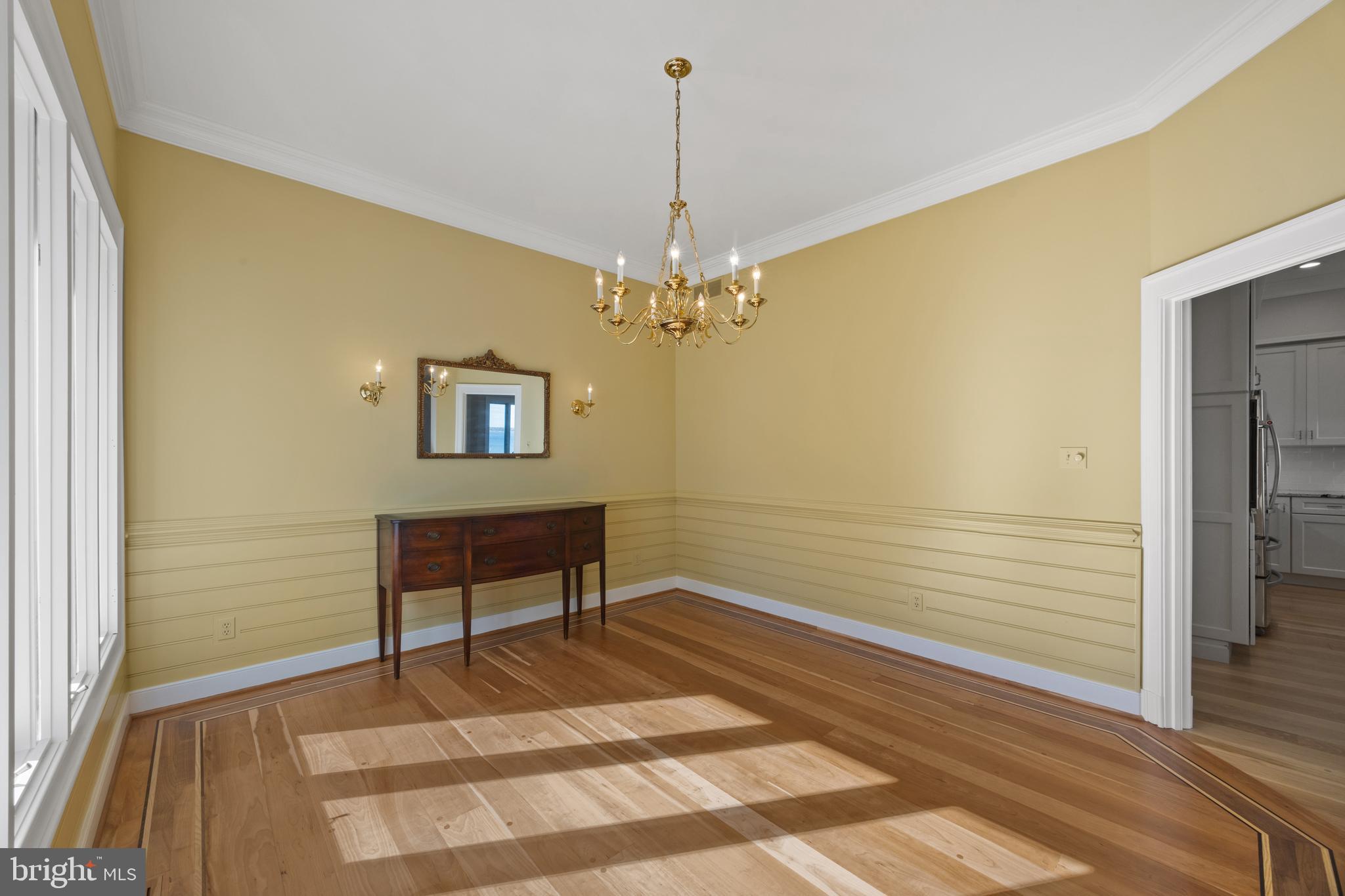 2907 Cox Neck Road East Chester, MD 21619 - Photo 24 of 43 a view of a room with a chandelier and wooden floor