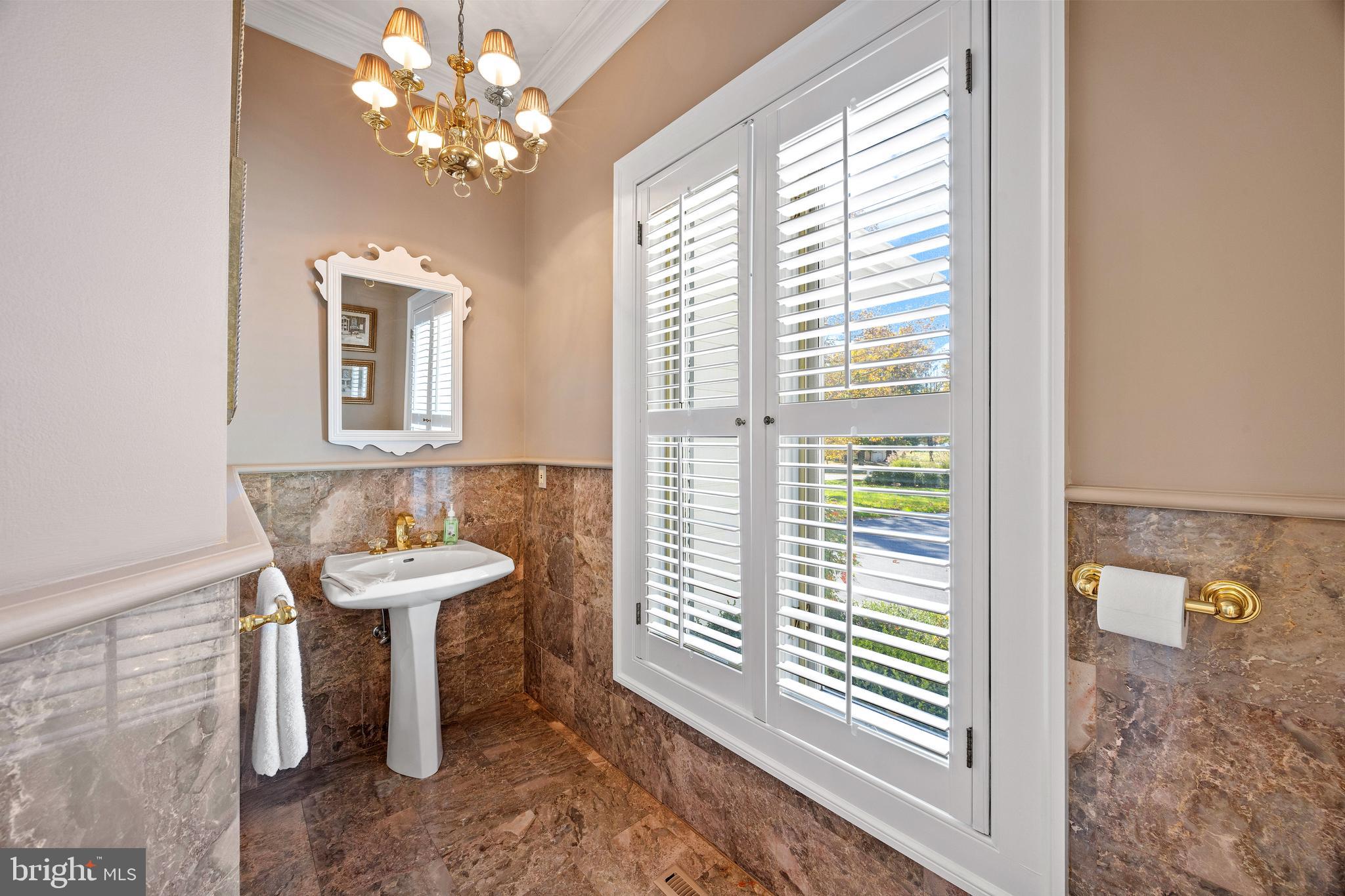 2907 Cox Neck Road East Chester, MD 21619 - Photo 26 of 43 a bathroom with a sink a mirror and a window