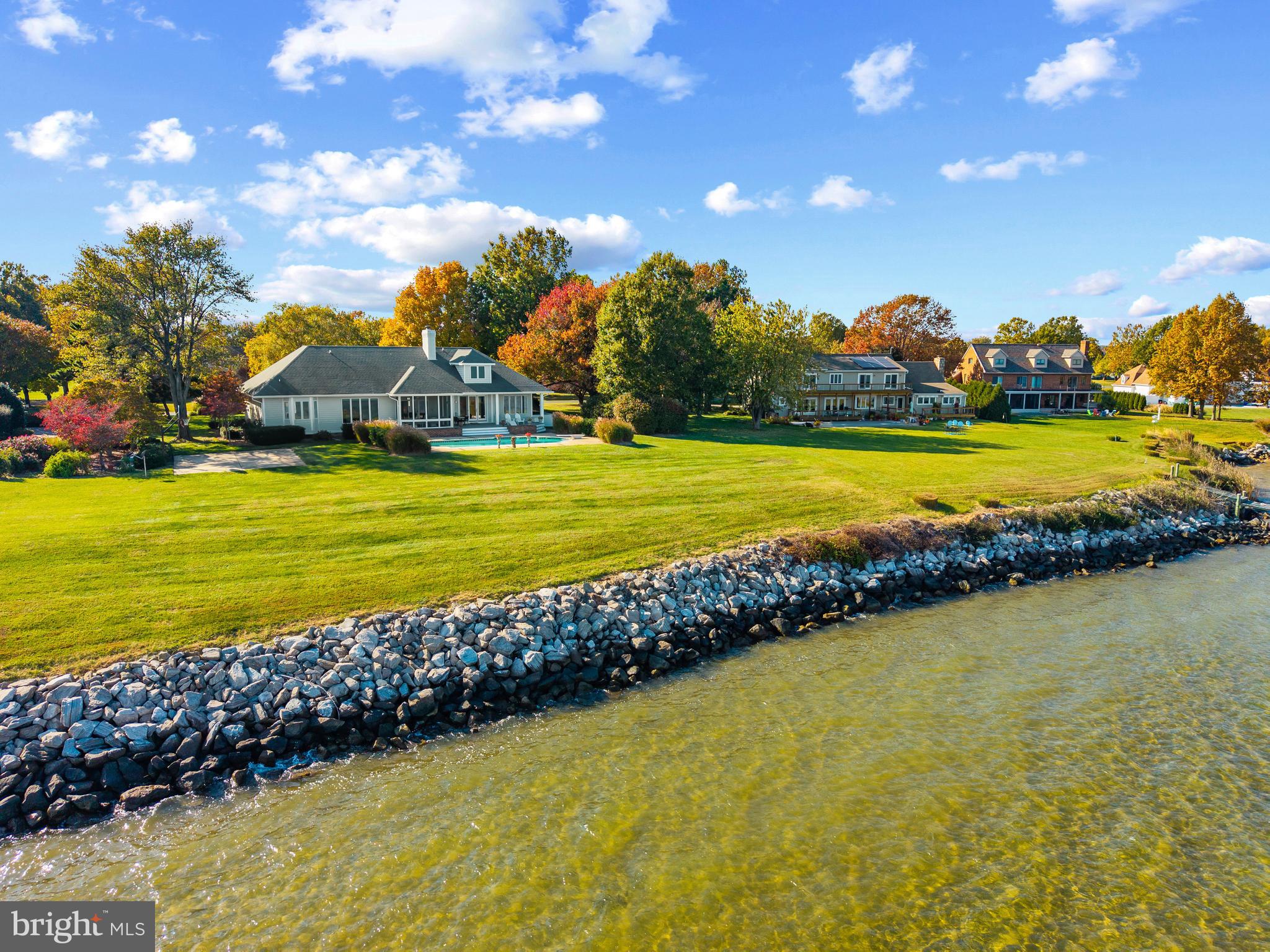 2907 Cox Neck Road East Chester, MD 21619 - Photo 3 of 43 a view of a swimming pool with an ocean view