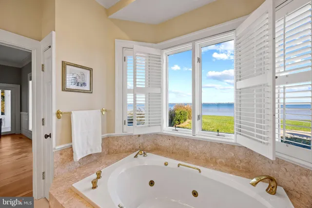 a bathroom with a double vanity sink a toilet and shower