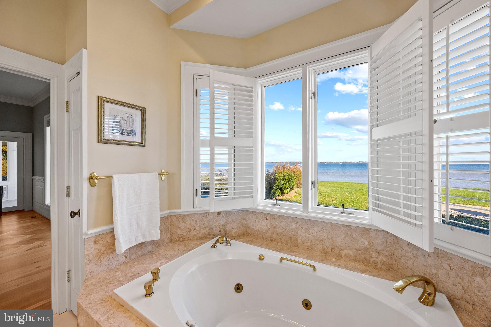 2907 Cox Neck Road East Chester, MD 21619 - Photo 31 of 43 a bathroom with a tub a sink and a large window