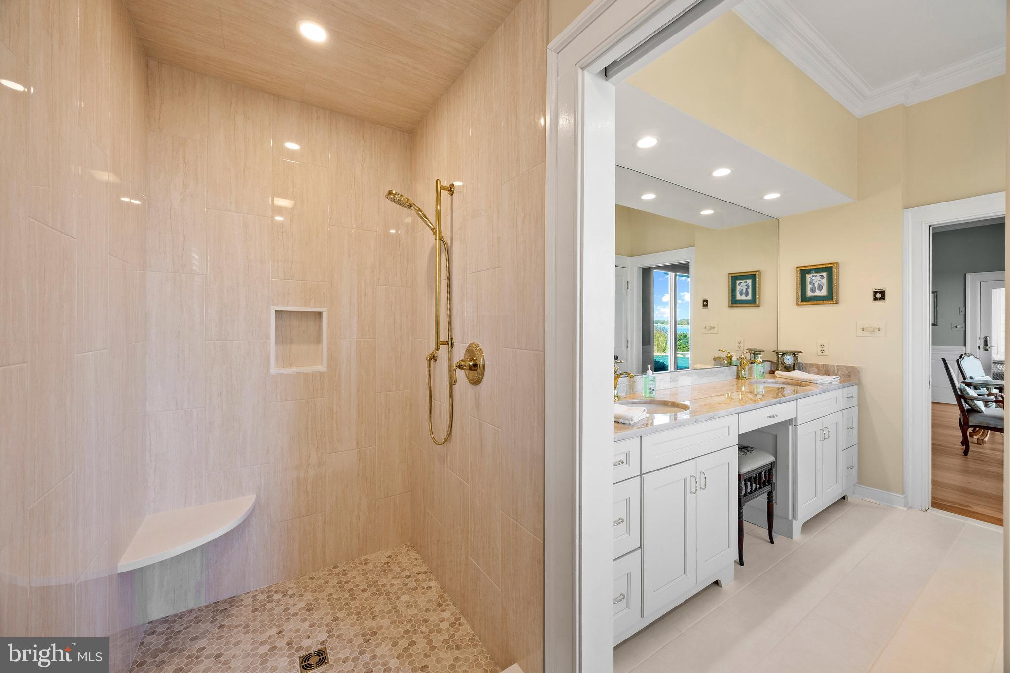 2907 Cox Neck Road East Chester, MD 21619 - Photo 32 of 43 a bathroom with a double vanity sink a toilet and shower