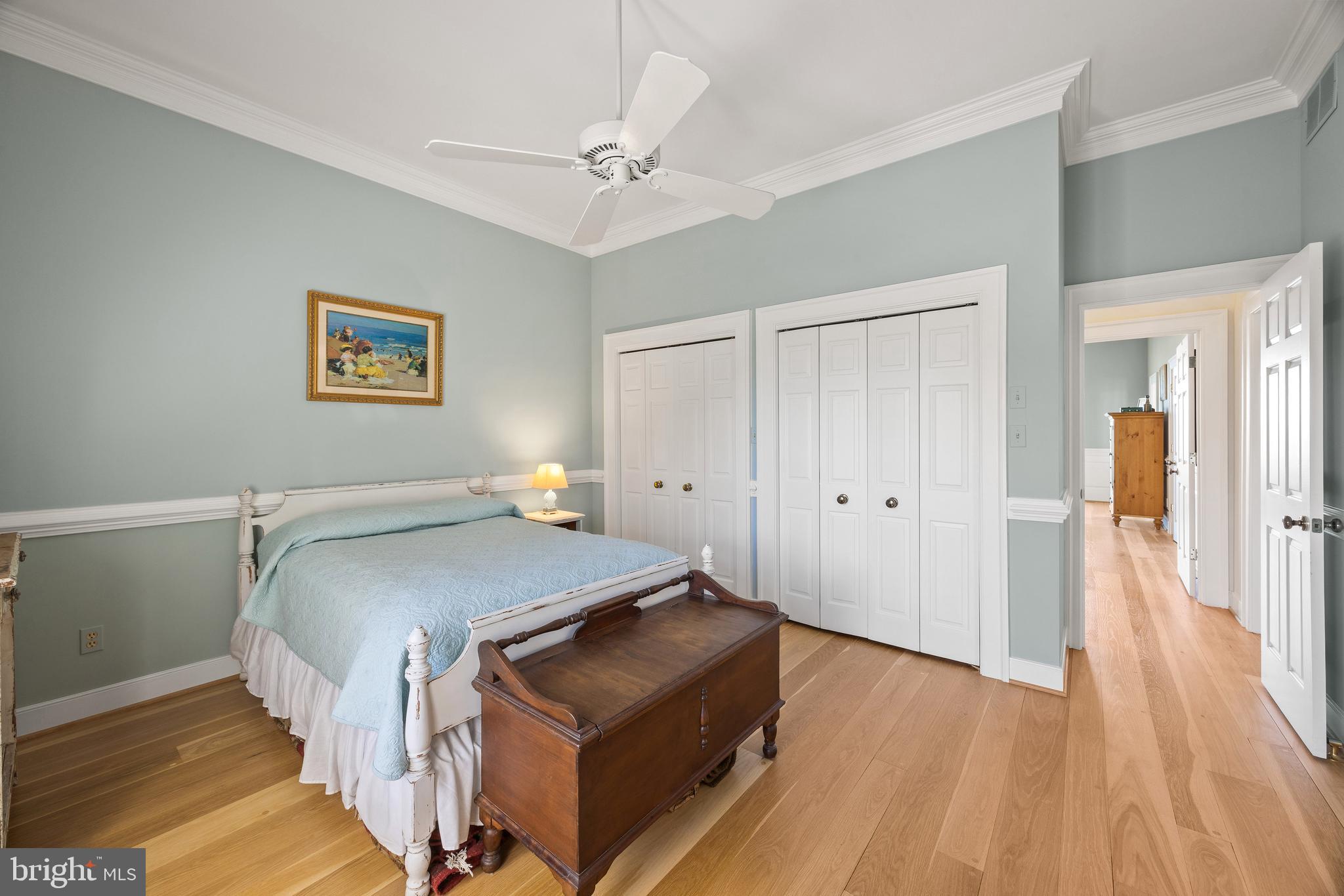 2907 Cox Neck Road East Chester, MD 21619 - Photo 34 of 43 a bedroom with a bed and a chandelier