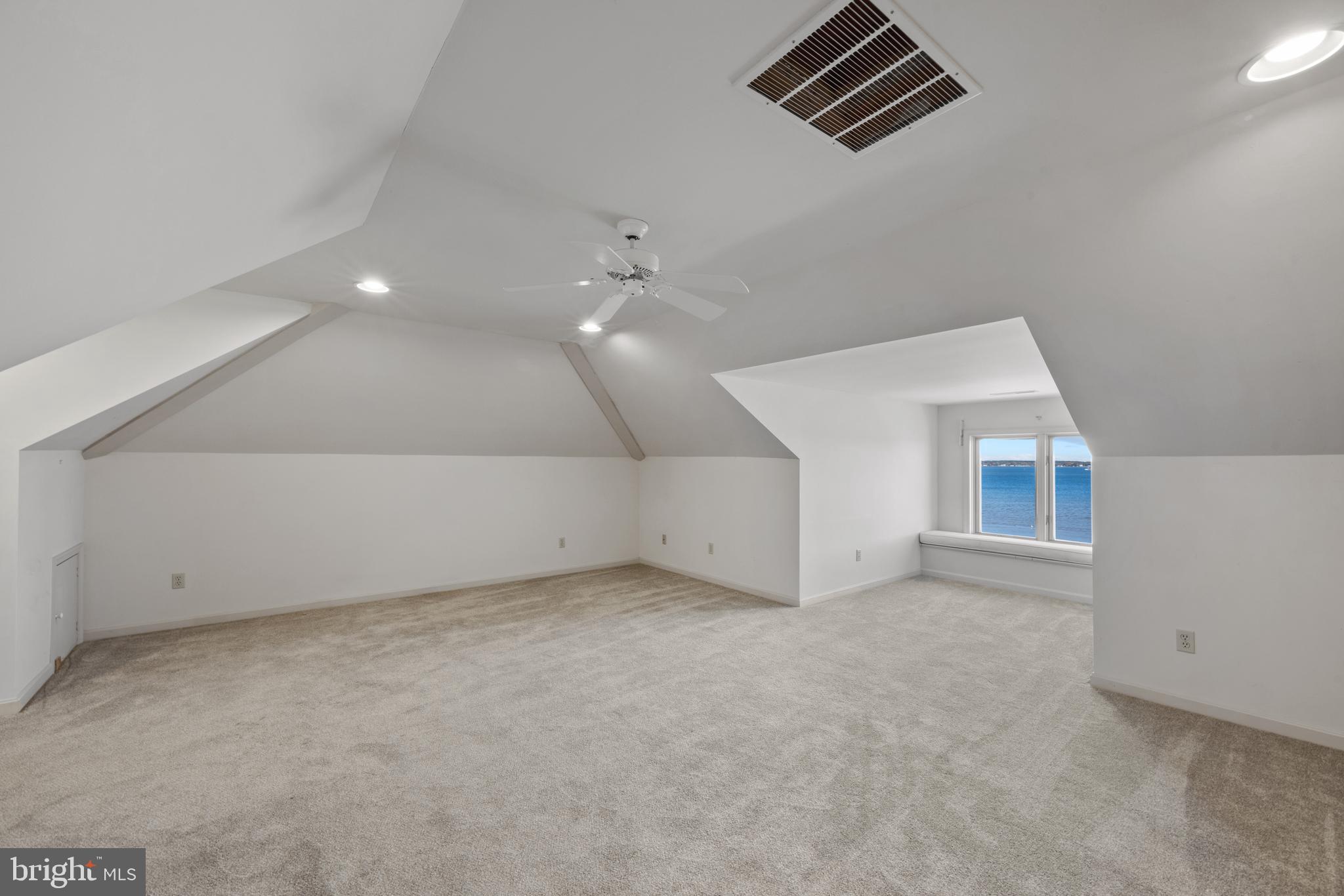 2907 Cox Neck Road East Chester, MD 21619 - Photo 38 of 43 an empty room with windows and fireplace