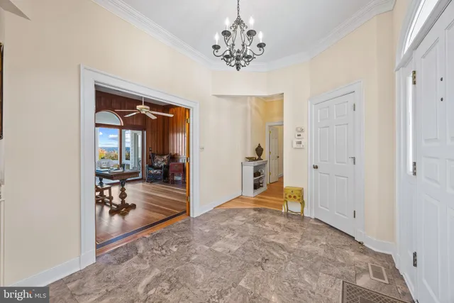 a kitchen with kitchen island granite countertop a counter space dining table and stainless steel appliances