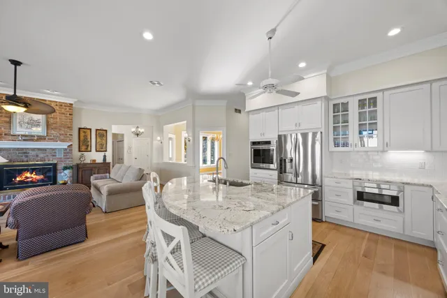 a very nice looking living room with wooden floor and furniture