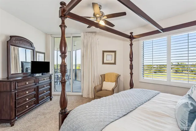 a bedroom with two beds and painting on the wall