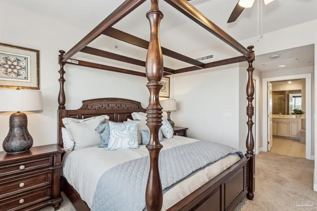 a bedroom with a bed and a television