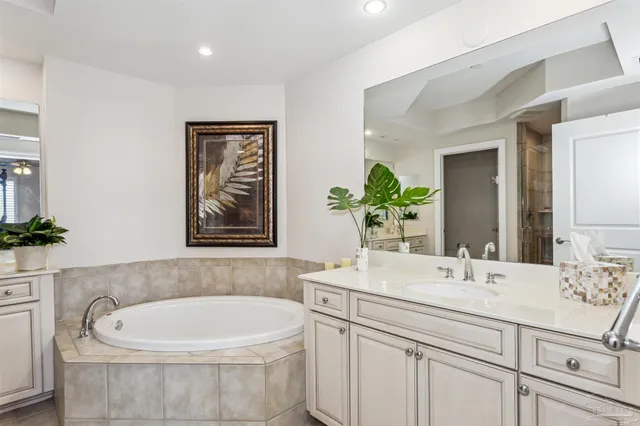 a bathroom with a sink toilet and mirror