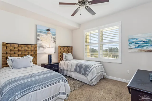 a living room with furniture and flat screen tv