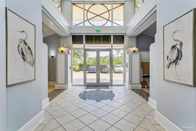 a living room with a large window and a white door