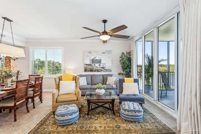 a kitchen with stainless steel appliances granite countertop a refrigerator a stove a sink a dining table and chairs