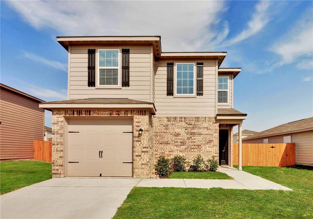 329 Yearwood Lane, Unit 11C Jarrell, TX 76537 - Photo 1 of 10 a front view of a house with a yard