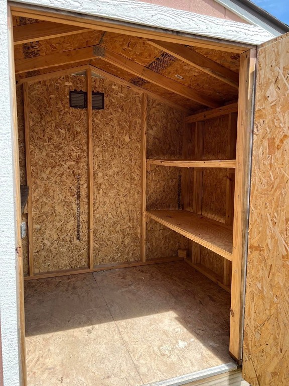 329 Yearwood Lane, Unit 11C Jarrell, TX 76537 - Photo 10 of 10 a blue bench sitting in front of a door