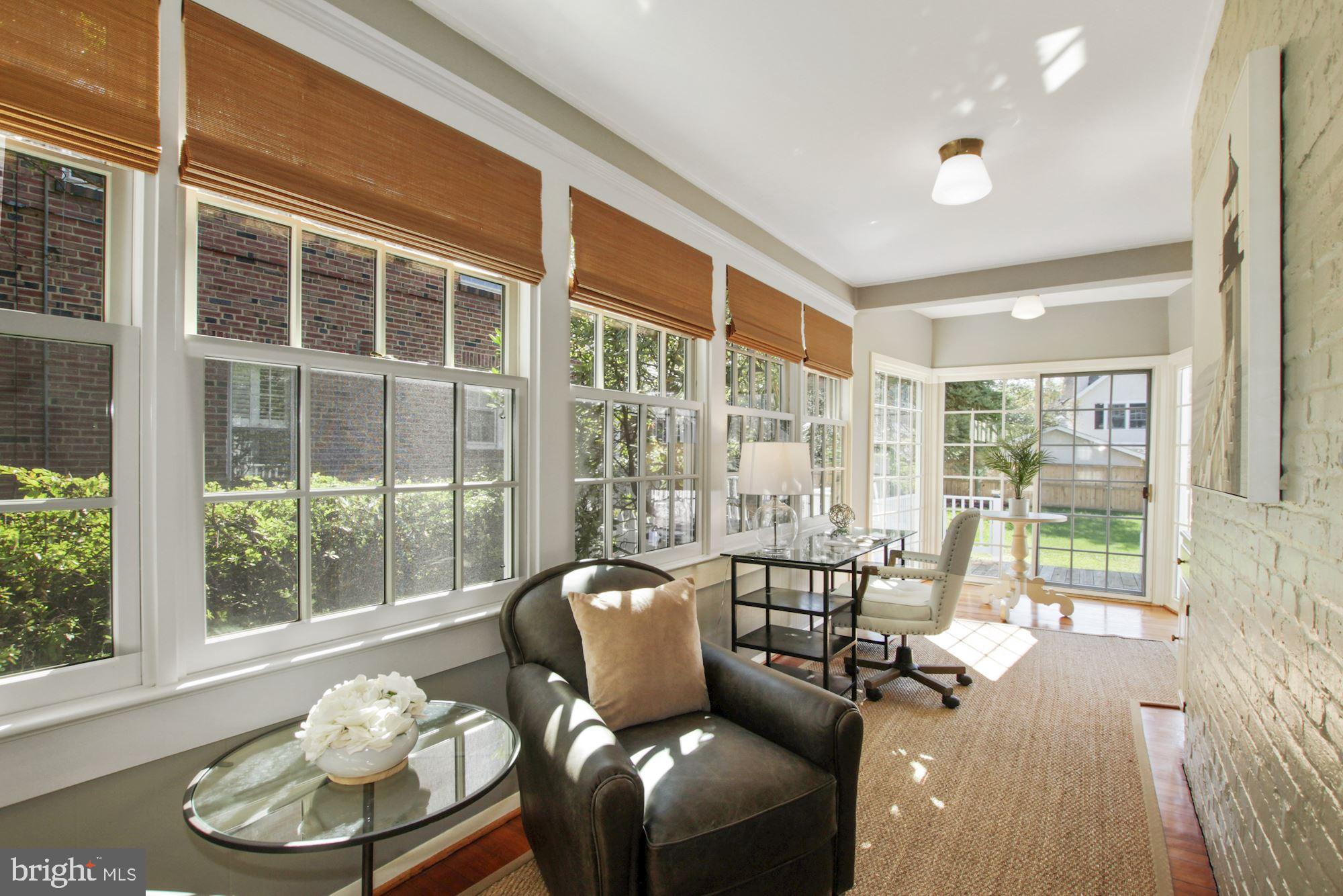 3906 Aspen Street Chevy Chase, MD 20815 - Photo 15 of 43 Sunroom with home office space overlooking grounds