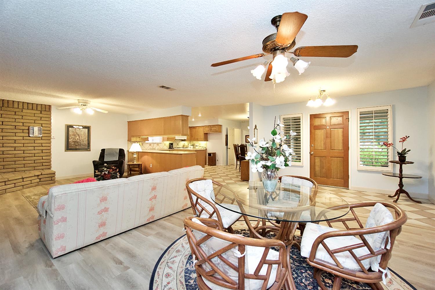 1004 Joy Street Madera, CA 93637 - Photo 11 of 29 a living room with dining table and a chandelier