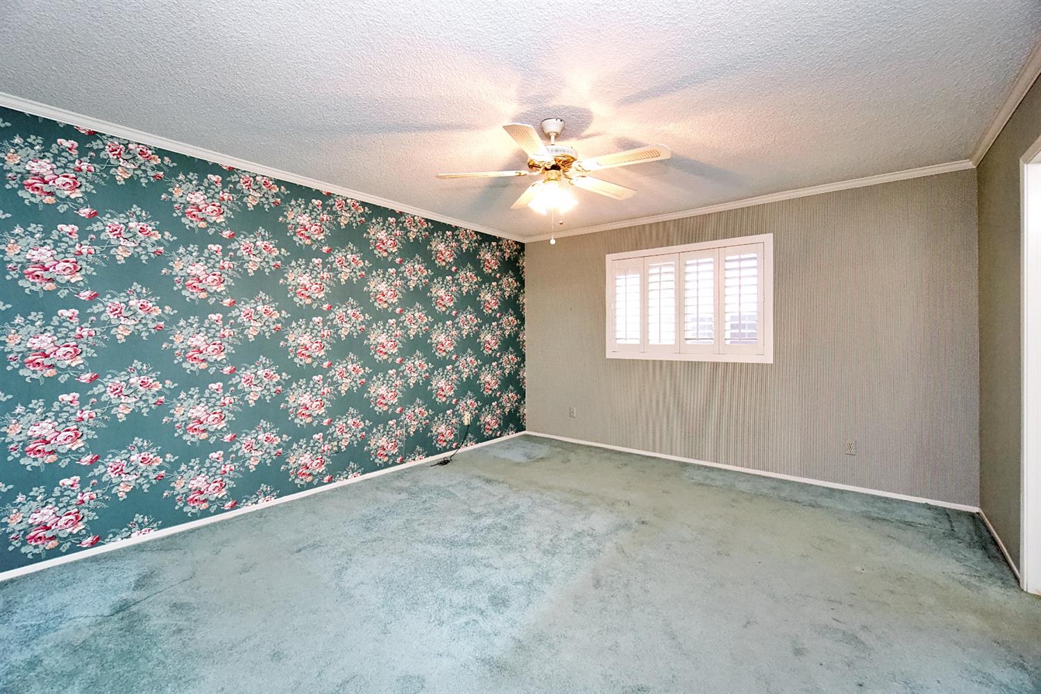 1004 Joy Street Madera, CA 93637 - Photo 20 of 29 an empty room with windows and ceiling fan