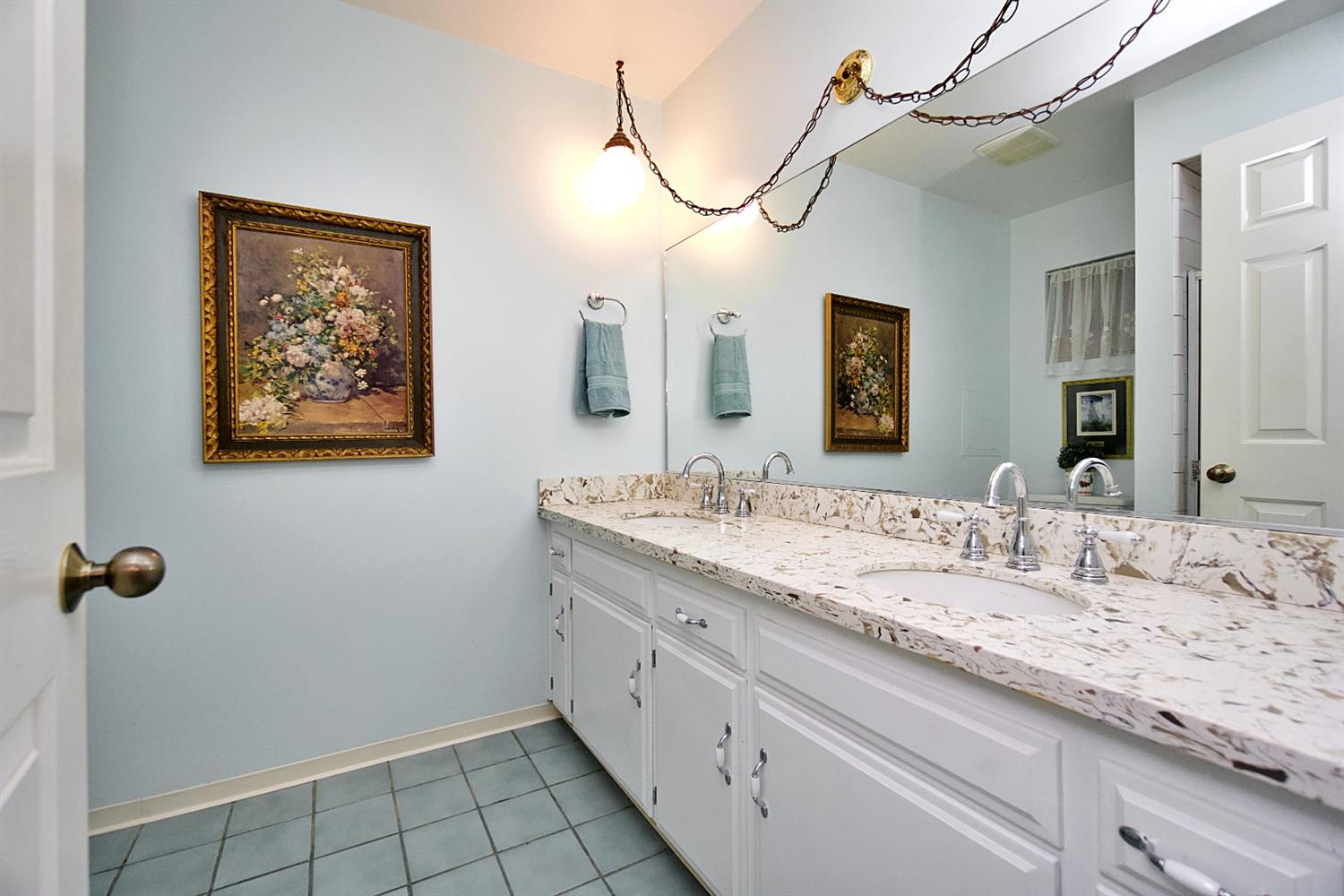1004 Joy Street Madera, CA 93637 - Photo 21 of 29 a bathroom with a granite countertop sink a mirror and a shower