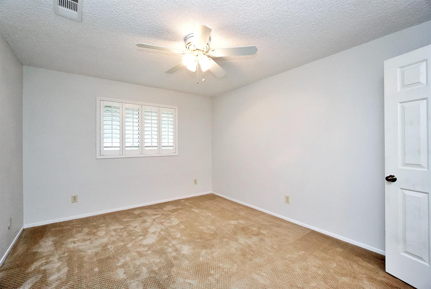 1004 Joy Street Madera, CA 93637 - Photo 23 of 29 wooden floor in an empty room with a window