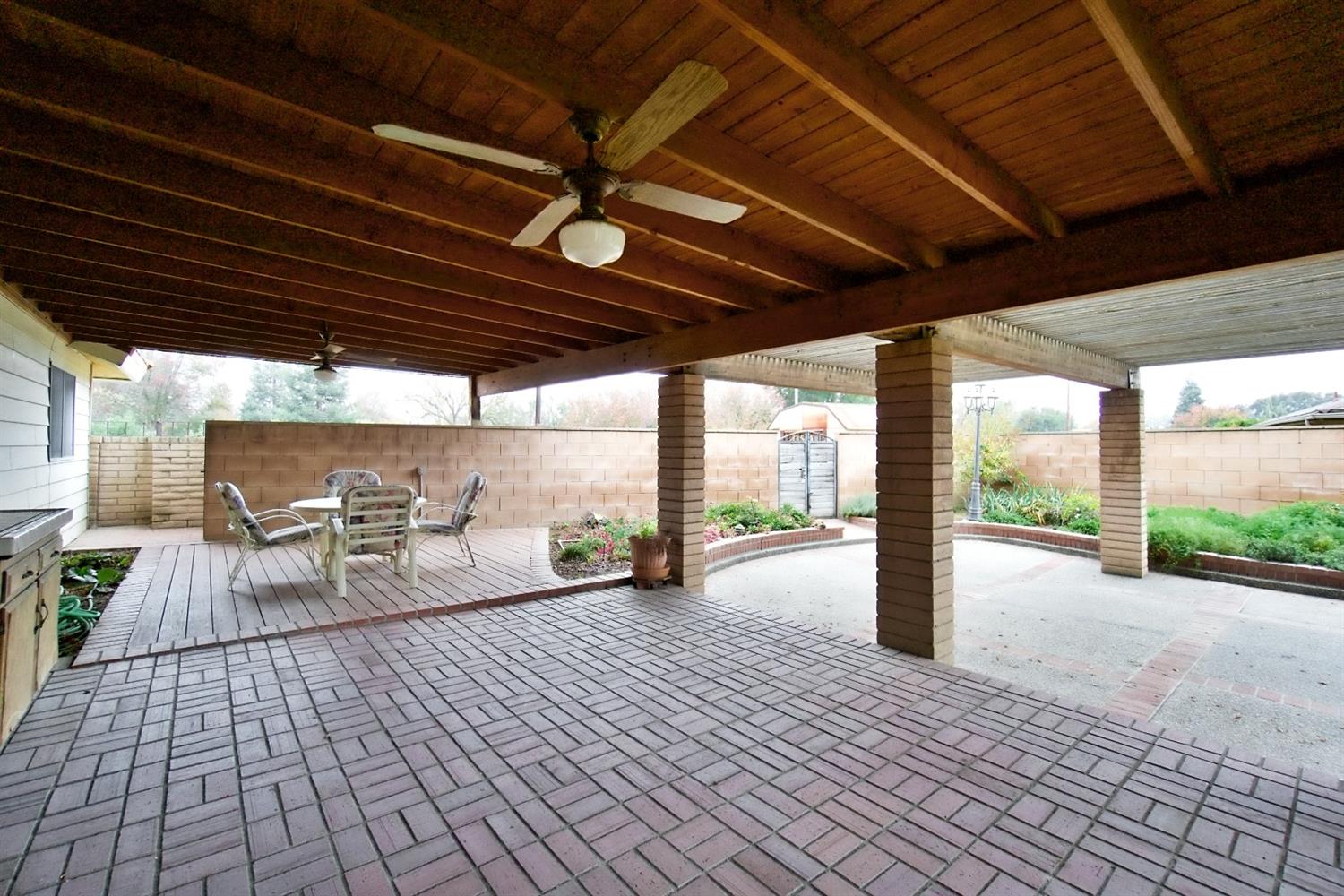 1004 Joy Street Madera, CA 93637 - Photo 25 of 29 a view of a patio with wooden floor