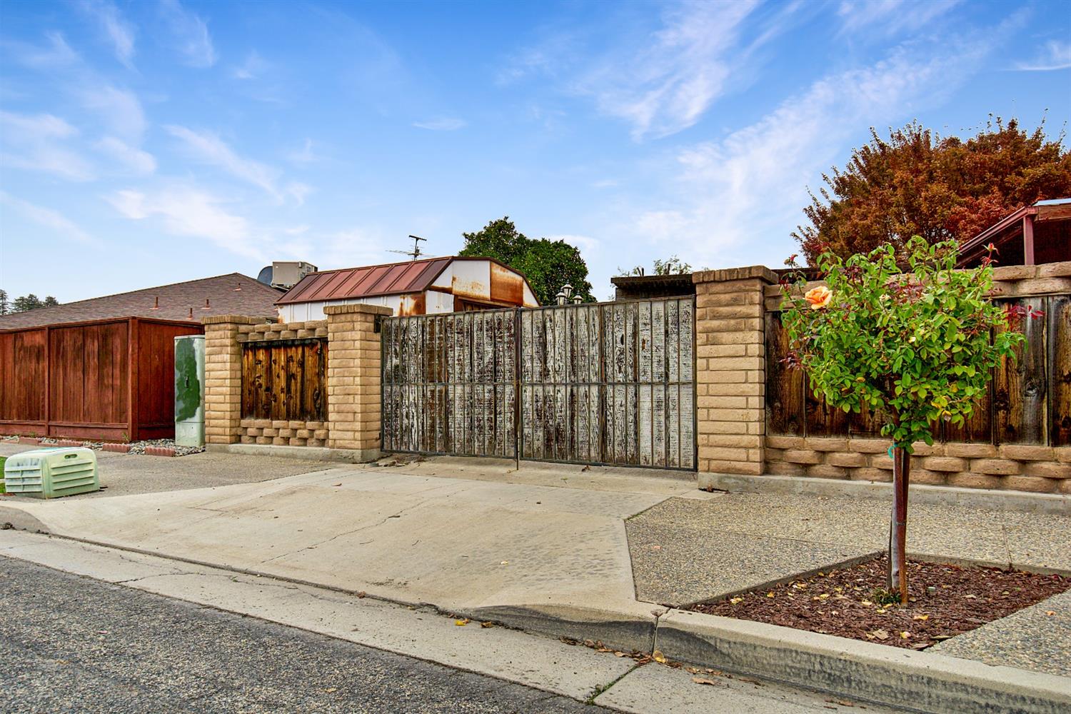 1004 Joy Street Madera, CA 93637 - Photo 29 of 29 a front view of a house with a yard