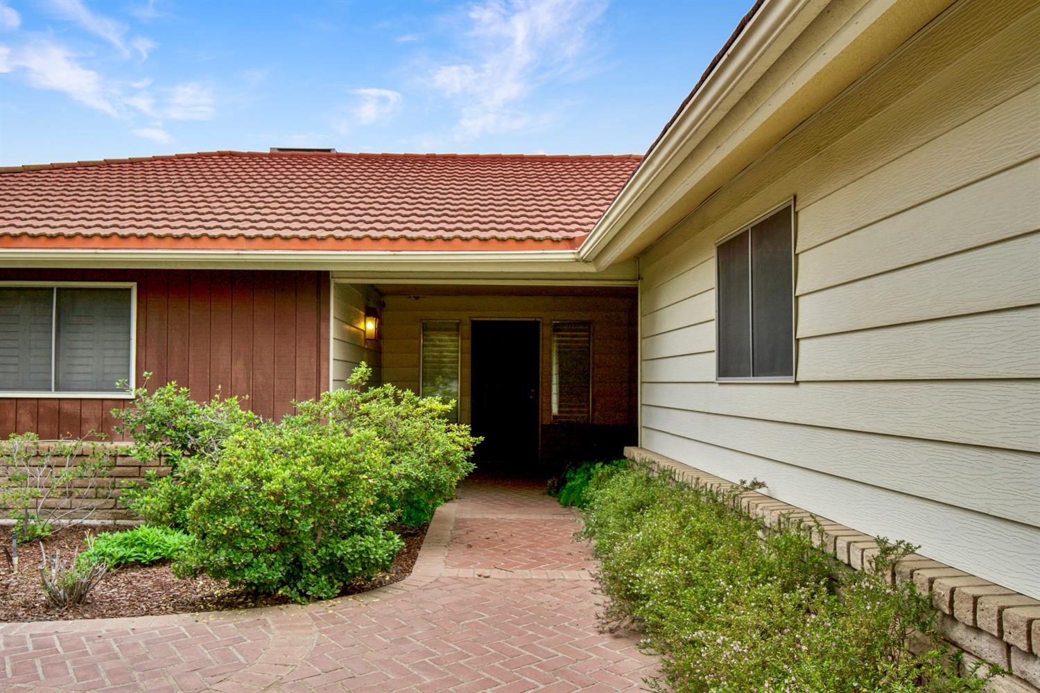1004 Joy Street Madera, CA 93637 - Photo 4 of 29 a front view of a house with garden