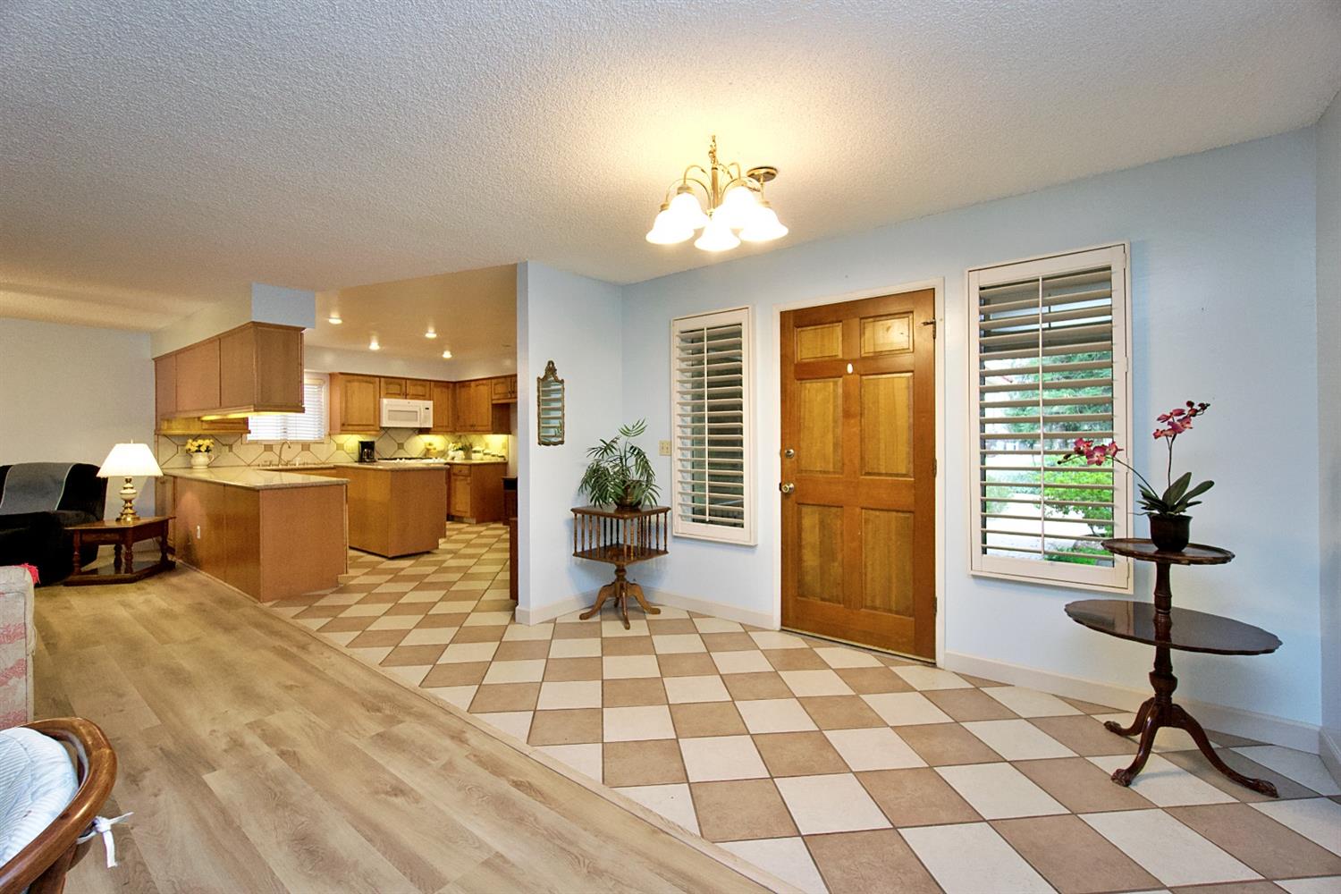 1004 Joy Street Madera, CA 93637 - Photo 6 of 29 a living room with a dining table chairs and kitchen view