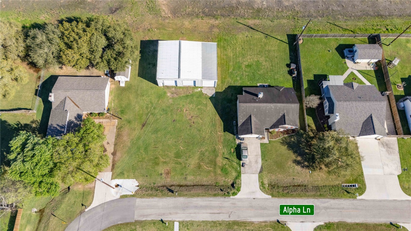 1324 Alpha Lane Crosby, TX 77532 - Photo 16 of 20 an aerial view of a house with a garden