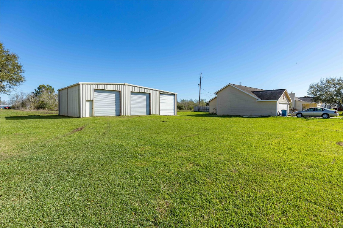 1324 Alpha Lane Crosby, TX 77532 - Photo 2 of 20 a view of a house with a big yard and large trees