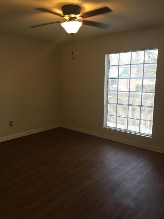 4709 Harmon Avenue, Unit 318 Austin, TX 78751 - Photo 5 of 7 a view of an empty room with wooden floor and a window