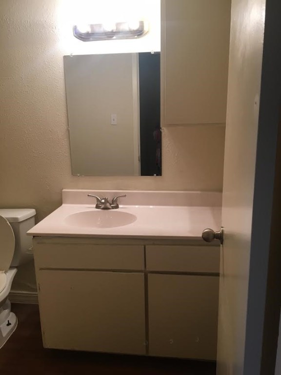 4709 Harmon Avenue, Unit 318 Austin, TX 78751 - Photo 7 of 7 a bathroom with a sink and a toilet