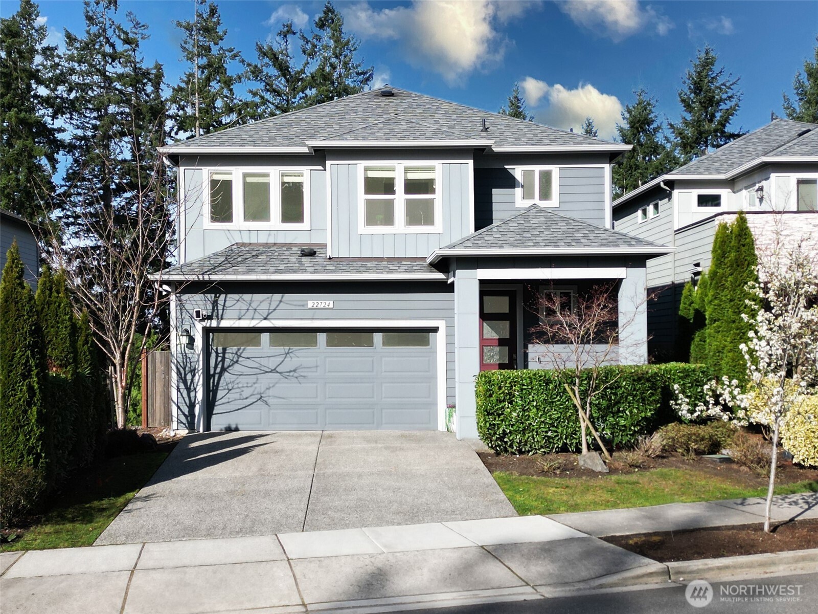 22724 41st Drive Southeast Bothell, WA 98021 - Photo 1 of 40 a front view of a house with a yard and garage