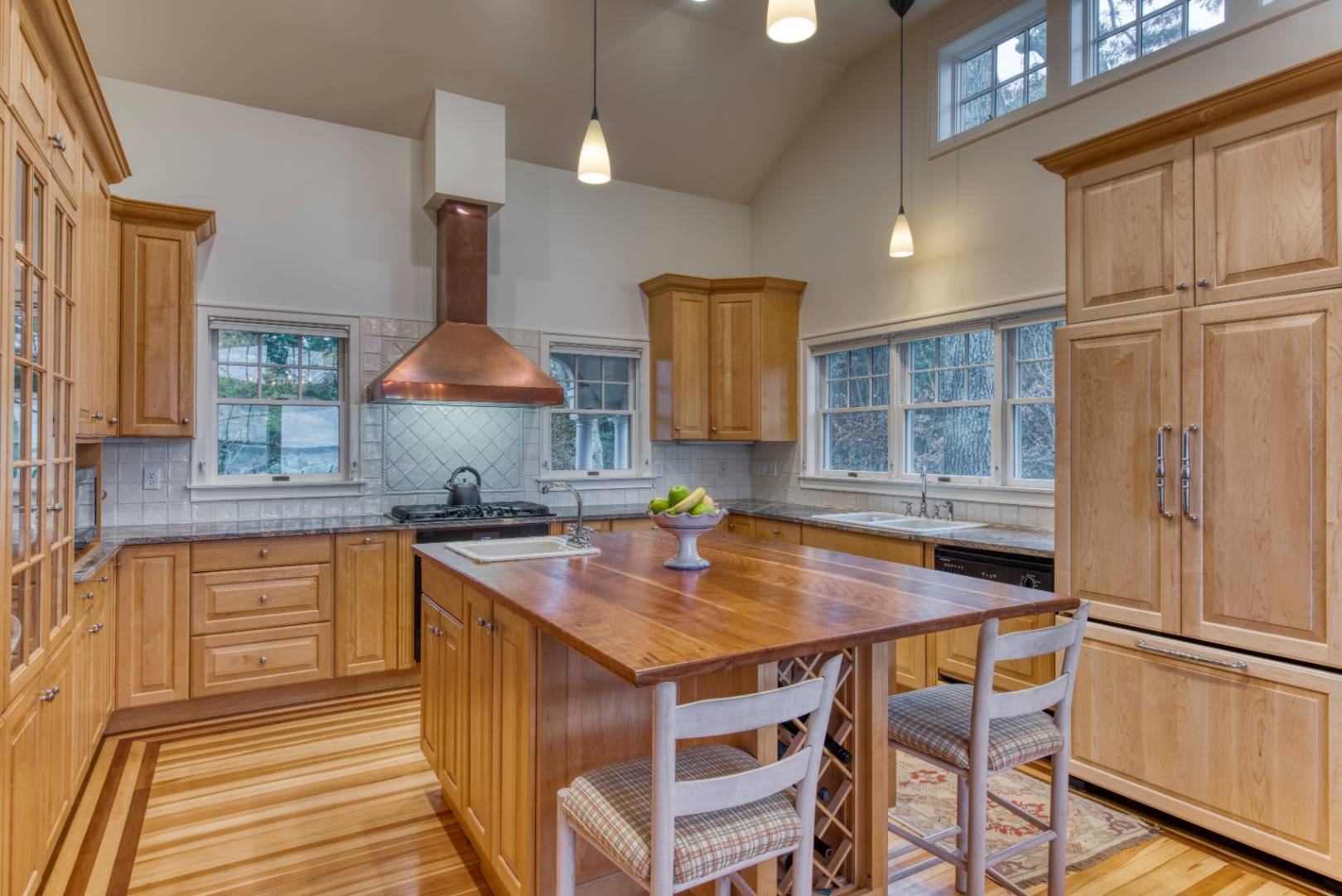 27 Rawson Road Sag Harbor, NY 11963 - Photo 2 of 14 a kitchen with stainless steel appliances granite countertop a sink and a refrigerator