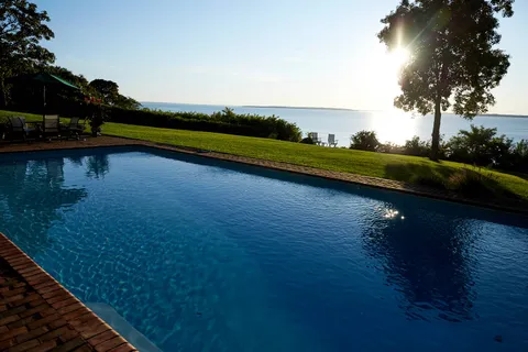 a view of swimming pool from a yard