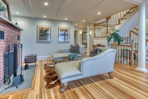 a living room with furniture and a table