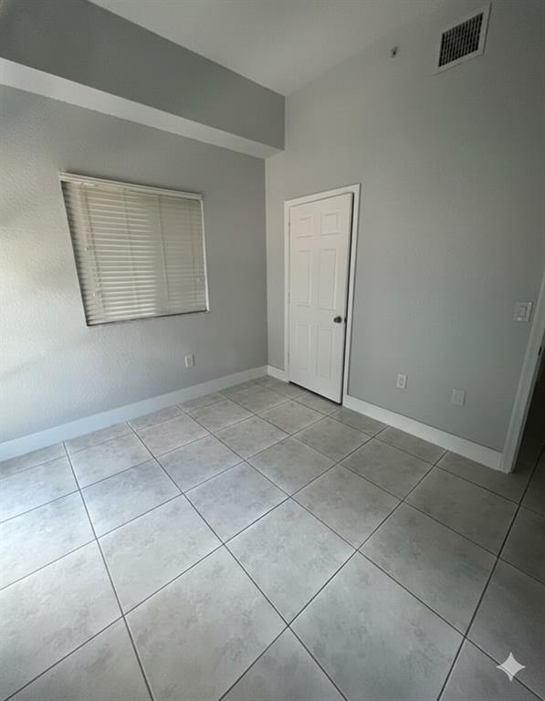 2801 Riverside Drive, Unit 204 Coral Springs, FL 33065 - Photo 12 of 18 a view of an empty room with a window
