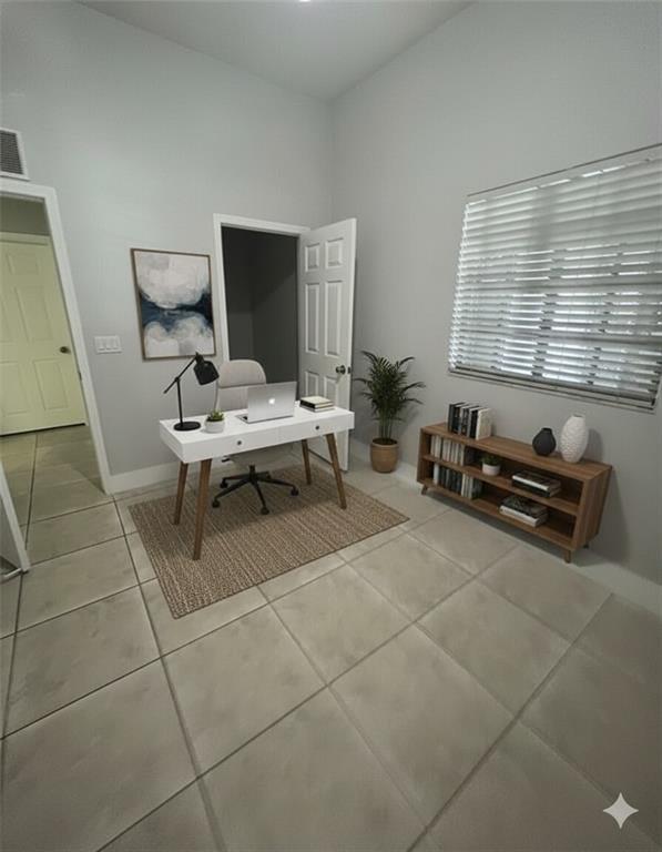 2801 Riverside Drive, Unit 204 Coral Springs, FL 33065 - Photo 13 of 18 a living room with furniture a flat screen tv and a window