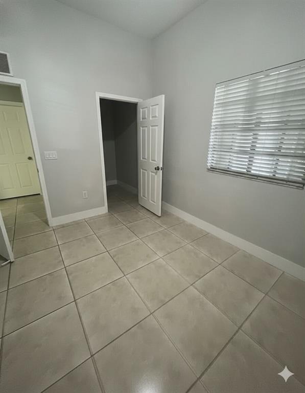 2801 Riverside Drive, Unit 204 Coral Springs, FL 33065 - Photo 14 of 18 a view of an empty room with a window