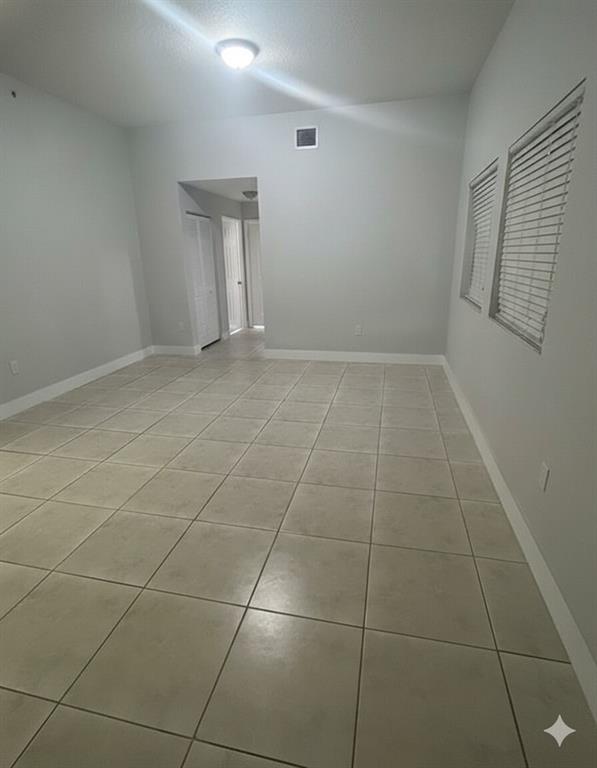 2801 Riverside Drive, Unit 204 Coral Springs, FL 33065 - Photo 18 of 18 a view of an empty room with a window