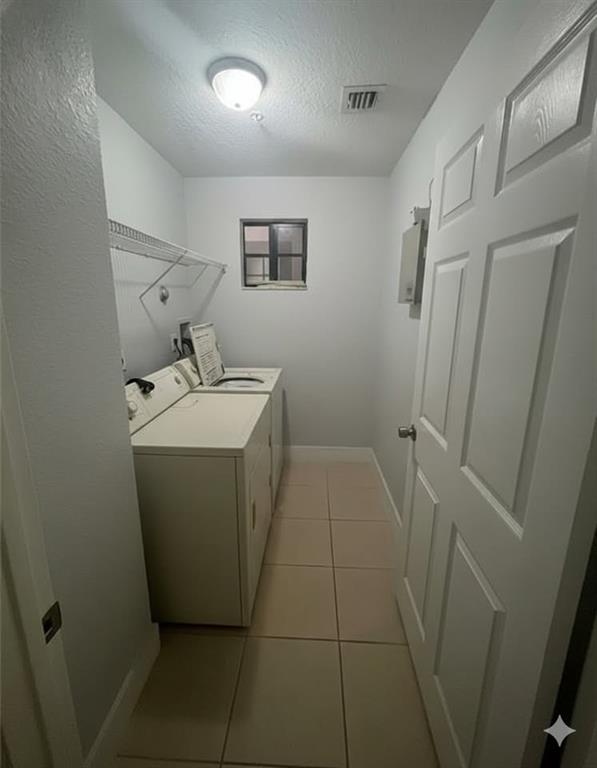 2801 Riverside Drive, Unit 204 Coral Springs, FL 33065 - Photo 4 of 18 a utility room with a washer and dryer
