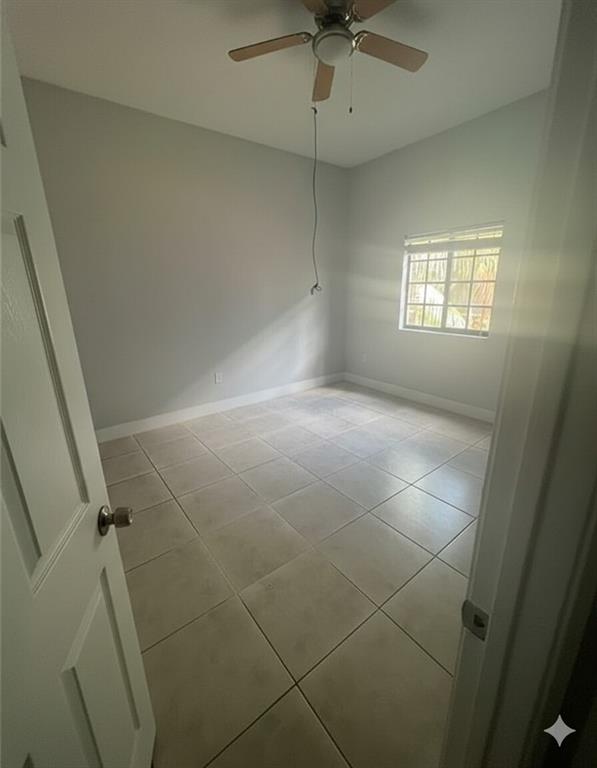 2801 Riverside Drive, Unit 204 Coral Springs, FL 33065 - Photo 7 of 18 a view of an empty room with a window