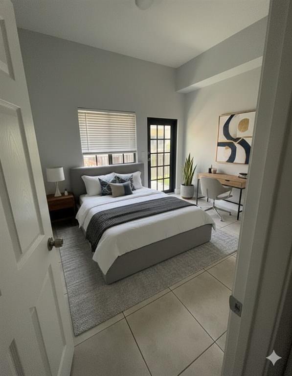 2801 Riverside Drive, Unit 204 Coral Springs, FL 33065 - Photo 9 of 18 a bedroom with a bed and a window