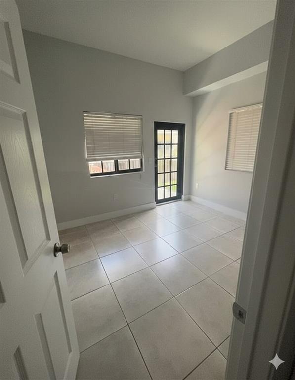 2801 Riverside Drive, Unit 204 Coral Springs, FL 33065 - Photo 10 of 18 a view of an empty room and window