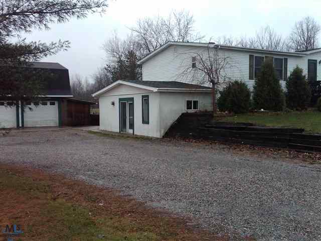 8769 Morris Road Goodells, MI 48027 - Photo 12 of 16 This is a view of the side of the home.