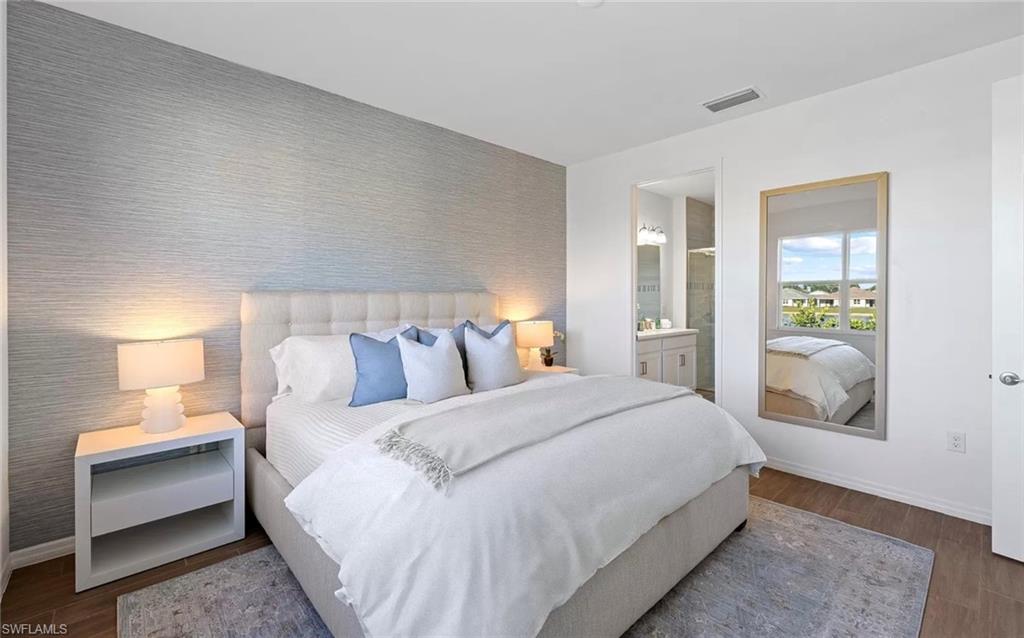 1213 Enbrook Loop Naples, FL 34114 - Photo 12 of 24 a bedroom with a bed and a lamp