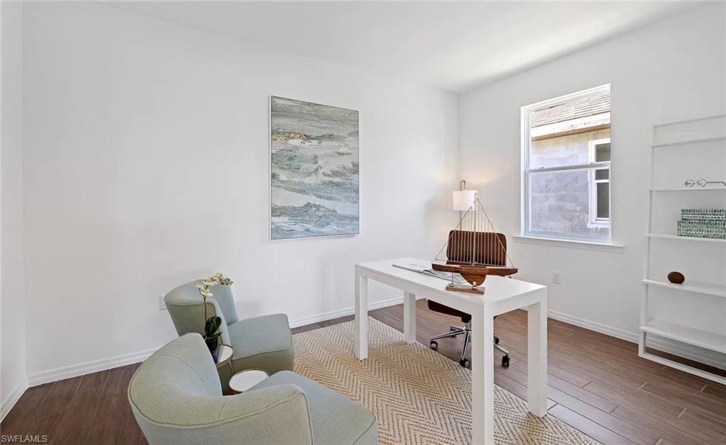 1213 Enbrook Loop Naples, FL 34114 - Photo 14 of 24 a workspace with furniture and a window