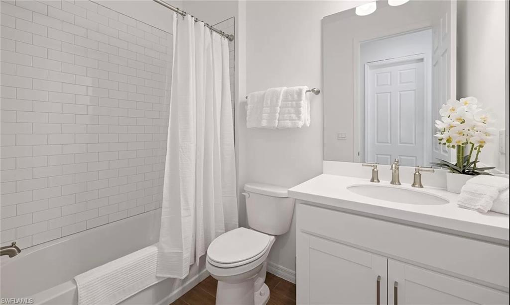 1213 Enbrook Loop Naples, FL 34114 - Photo 16 of 24 a bathroom with a sink a toilet and shower