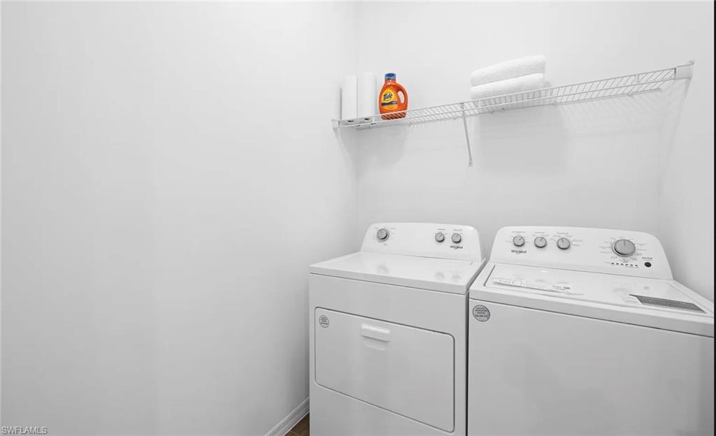 1213 Enbrook Loop Naples, FL 34114 - Photo 17 of 24 a utility room with dryer and washer