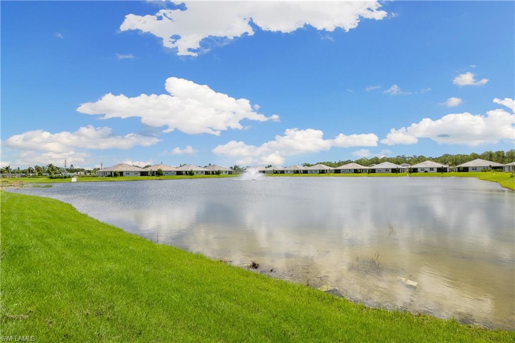 1213 Enbrook Loop Naples, FL 34114 - Photo 23 of 24 a view of a lake with a mountain in the background