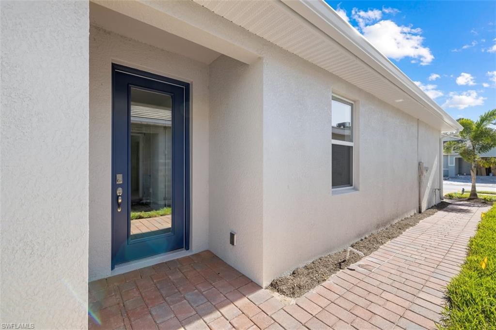 1213 Enbrook Loop Naples, FL 34114 - Photo 4 of 24 a view of a house with a backyard